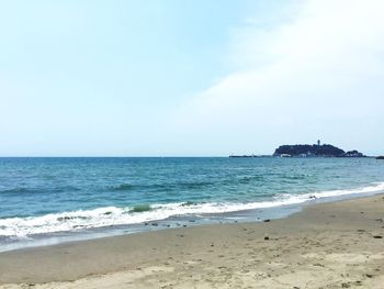 Scenic view of beach against sky