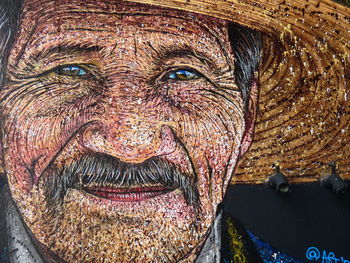 Close-up portrait of man painting