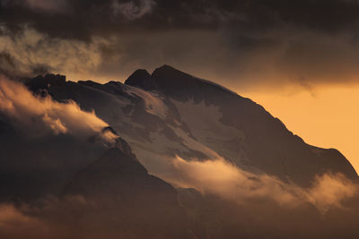 Scenic view of mountains against dramatic sky