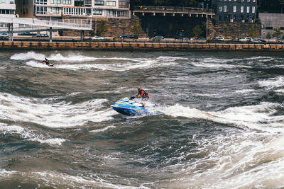 People on boat in sea