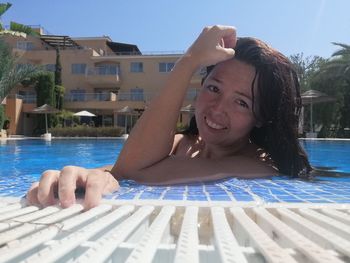 Portrait of happy boy in swimming pool