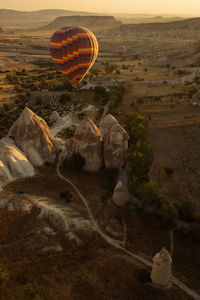 Aerial view of hot air balloon over city