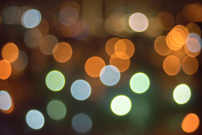 Defocused image of illuminated lights at night