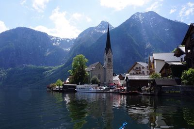 Scenic view of lake and mountains against sky