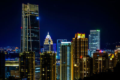 Illuminated buildings in city at night