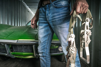 Low section of man sitting in car