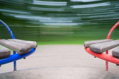 Close-up of metallic chair at swimming pool