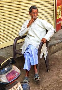 Portrait of man sitting outdoors