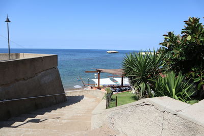 Scenic view of sea against clear blue sky