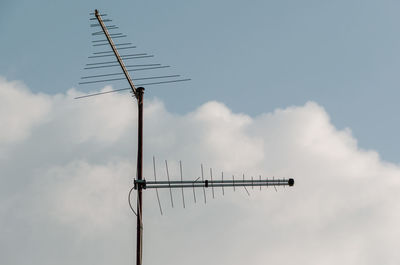 Low angle view of wind turbine against sky