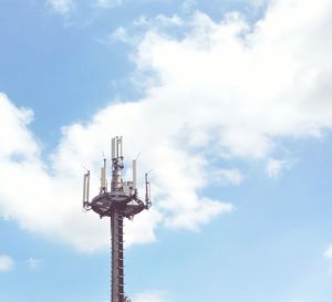 Low angle view of communications tower against sky