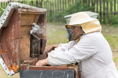 Side view of a man working