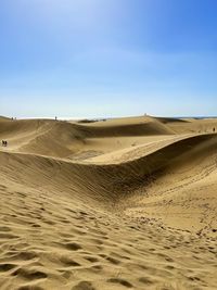 Scenic view of desert against clear sky