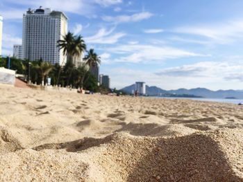 View of beach against cloudy sky