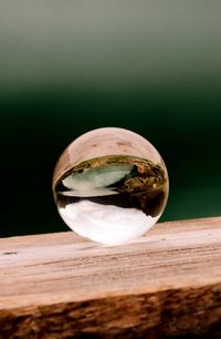 Close-up of crystal ball on glass