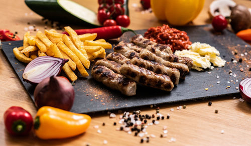 Close-up of fruits and vegetables on cutting board