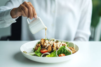 Midsection of man holding food