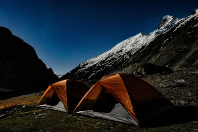 High angle view of tent on mountain against sky at night