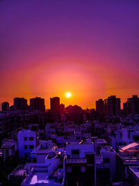 Cityscape against sky during sunset