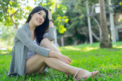 Young woman sitting at park