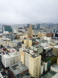 High angle view of buildings in city against sky