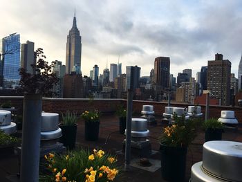 City skyline against cloudy sky