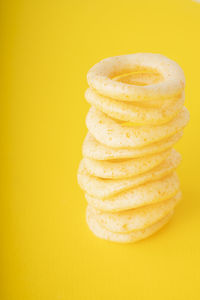 Close-up of bread on yellow background