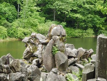 Stones on rocks by lake
