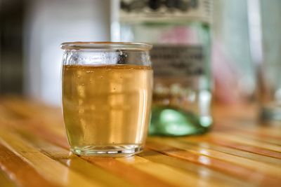 Close-up of beer glass on table