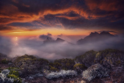 Scenic view of mountains against sky during sunset