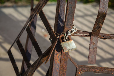 Close-up of padlock on fence