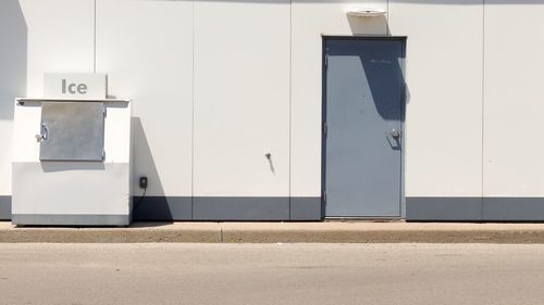 View of gray door next to road