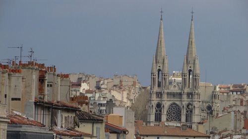 View of cathedral in city against clear sky