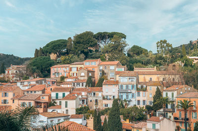 Buildings in town against sky