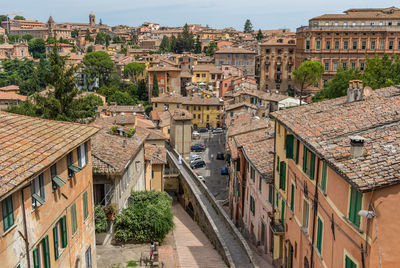 High angle view of street amidst buildings in town