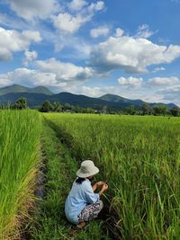 Scenic view of agricultural field against sky