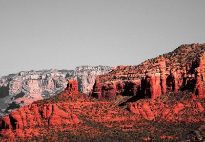 Rock formations on landscape against clear sky