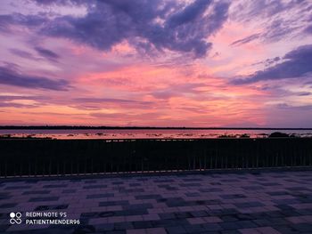 Scenic view of sea against orange sky