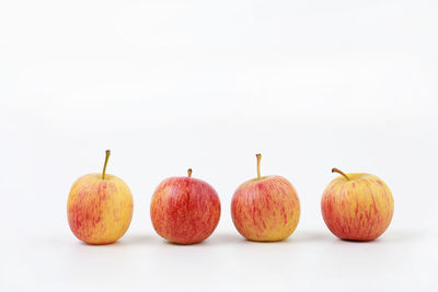 Close-up of apples against white background