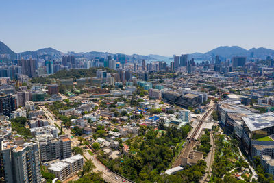 High angle view of city buildings against sky