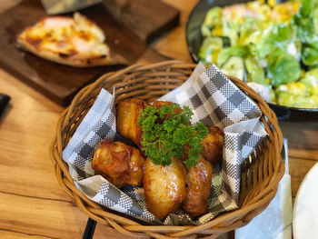 High angle view of food in basket on table