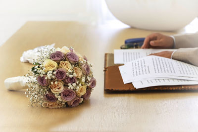 Close-up of rose bouquet on book