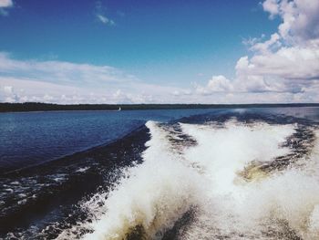 Scenic view of sea against cloudy sky