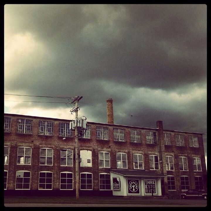 architecture, building exterior, built structure, sky, transfer print, cloud - sky, cloudy, low angle view, auto post production filter, overcast, cloud, window, building, residential building, weather, city, residential structure, day, power line, outdoors