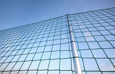 Low angle view of modern building against clear blue sky