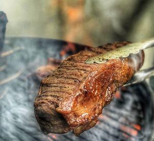 High angle view of meat on barbecue grill