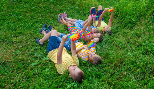 High angle view of boy playing on grassy field