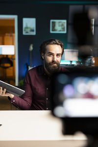 Portrait of young man using mobile phone