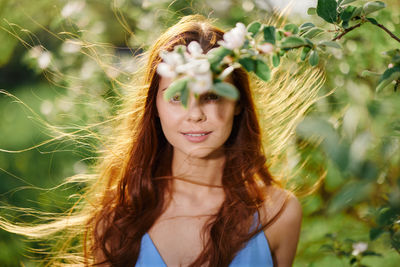 Portrait of young woman with eyes closed