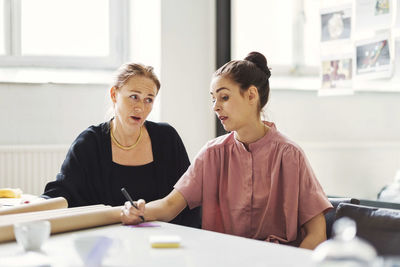 Businesswomen discussing on new project at conference table